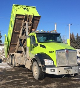 Truck unloading material from Hinton in order to consolidate for later shipping.